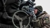 UKRAINE – A Ukrainian service member prepares to shoot from a howitzer at a front line, as Russia's attack on Ukraine continues, in Zaporizhzhia Region, December 16, 2022