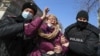 Kazakhstan. Police detain a woman during a rally. Almaty, February 28, 2021