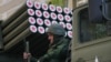 Ukraine - An army soldier of the Donetsk People's Republic (DPR) sitting on a Grad multiple rocket launcher during a Victory Day parade rehearsal in Artyom Street, May 5, 2015