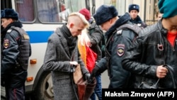 RUSSIA -- Russian police search opposition activists during a protest rally in central Moscow, November 5, 2017